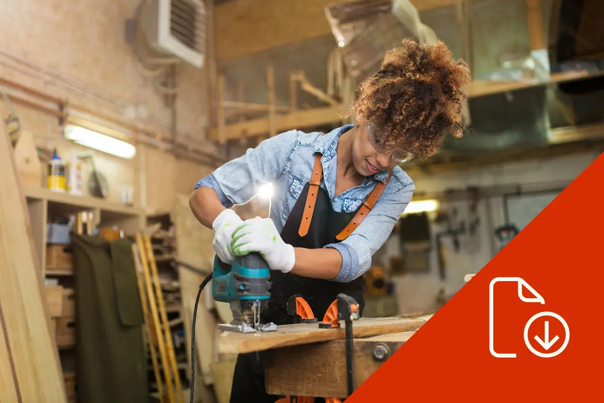 woman using power tools for carpentry