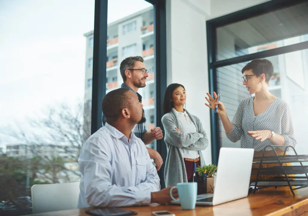 group of people discussing ideas in a conference room