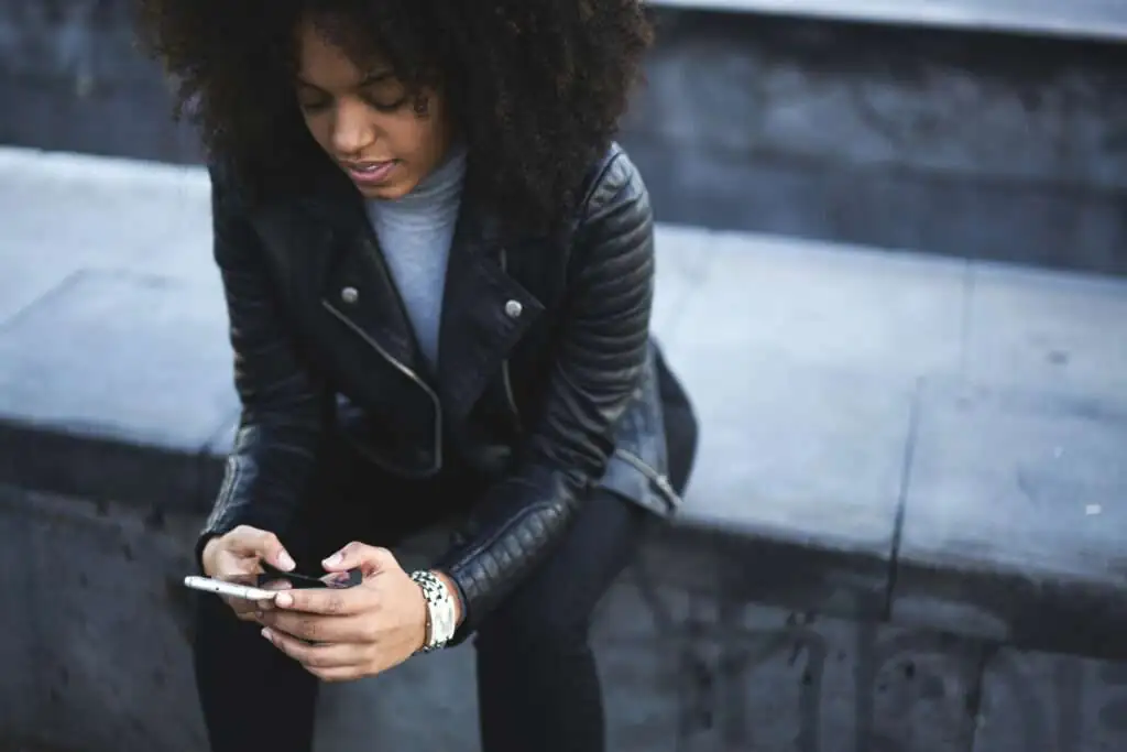 woman texting on mobile device