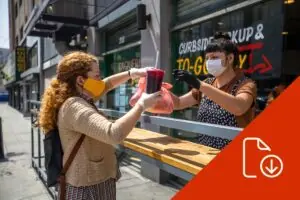 woman purchasing food from a vendor