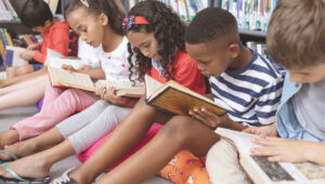 Group of children reading books